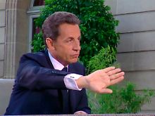 Versucht sich die Kritiker vom Leibe zu halten, Präsident Sarkozy.