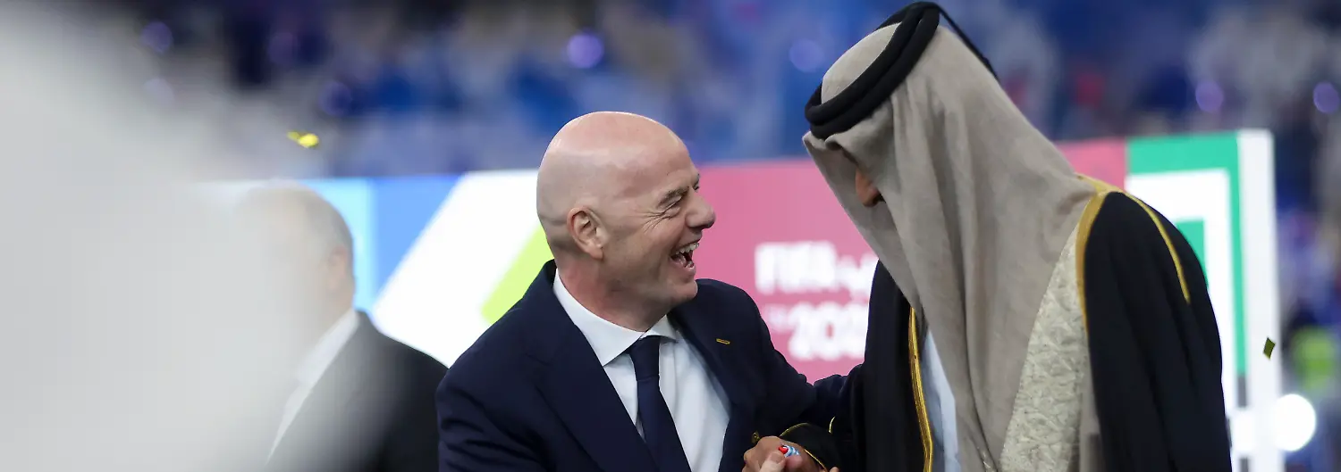 FIFA-president-Gianni-Infantino-and-Emir-of-Qatar-Sheikh-Tamim-bin-Hamad-Al-Thani-stand-on-the-podium-after-the-FIFA-Arab-Cup-2025-final-match-between-Jordan-and-Morocco-at-Lusail-Stadium-in-Doha-Qatar-on-December-18-2025