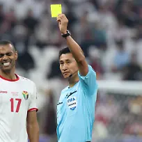 240211-LUSAIL-Feb-11-2024-Referee-Ma-Ning-R-shows-yellow-card-to-Jordan-s-Salem-Al-Ajalin-during-the-final-match-between-Qatar-and-Jordan-of-AFC-Asian-Cup-at-Lusail-Stadium-in-Lusail-Qatar-on-Feb-10-2024