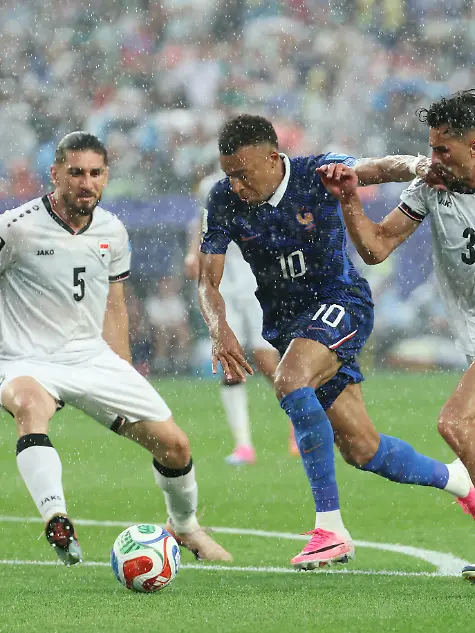 France-s-Kylian-Mbappe-center-drives-toward-goal-during-the-first-half-of-a-World-Cup-Group-I-soccer-match-against-Iraq-in-Philadelphia-Monday-June-22-2026-Mbappe-scored-twice-as-France-beat-Iraq-3-0-for-its-second-straight-win-in-Group-I