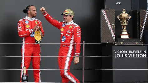 Formula-One-F1-British-Grand-Prix-Silverstone-Circuit-Silverstone-Britain-July-5-2026-Ferrari-s-Charles-Leclerc-celebrates-on-the-podium-after-winning-the-British-Grand-Prix-with-Ferrari-s-Lewis-Hamilton-who-finished-in-third-place-REUTERS-Andrew-Boyers