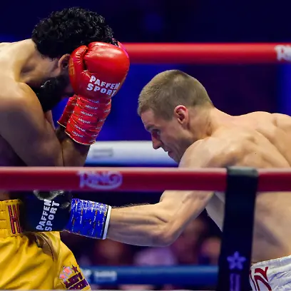 JEDDAH-SAUDI-ARABIA-JULY-25-Simon-Zachenhuber-white-and-red-shorts-punches-Hamzah-Sheeraz-yellow-and-red-shorts-during-the-WBO-World-Super-Middleweight-title-fight-between-Hamzah-Sheeraz-and-Simon-Zachenhuber-in-the-Anthony-Joshua-v-Kristian-Prenga-The-Comeback-fight-night-at-Jeddah-Superdome-on-July-25-2026-in-Jeddah-Saudi-Arabia