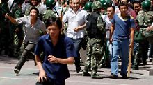 Chinesen jagen Uiguren / Mindestens 156 Tote: Merkel ermahnt China