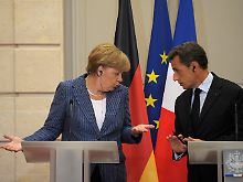 Zu zweit fallen Entscheidungen viel leichter: Merkel und Frankreichs Präsident  Sarkozy planen Europas Zukunft.
