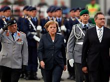 Bundeskanzlerin Merkel und Verteidigungsminister Jung nahmen an der Veranstaltung teil.