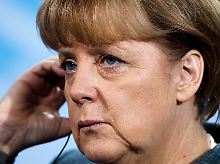 Angela Merkel reagiert verhalten.