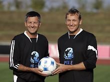 Adidas-Chef Herbert Hainer (l) und Puma-Chef Jochen Zeitz in seltener Eintracht. 