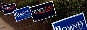 Spuren eines langen Kampfes: Werbeschilder von Newt Gingrich und Mitt Romney.
