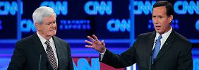 Bei der CNN-Debatte im Oktober 2011 wurde Santorum (r.) kaum wahrgenommen - das hat sich geändert.