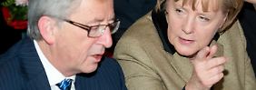 Angela Merkel, mit Euro-Gruppenchef Jean-Claude Juncker.