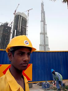 Wanderarbeiter auf einer Baustelle in Dubai City.