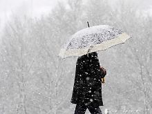 Nicht nur in Spanien braucht man derzeit eine Mütze - oder einen Schneeschirm.