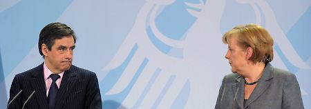 Einig im Kampf gegen Staatskrisen: Der französische Premierminister Fillon und Bundeskanzlerin Merkel. 