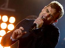 Robbie Williams steht bei EMI unter Vertrag.
