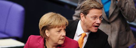 Einfach laufen lassen? Merkel und Westerwelle befinden sich nach der NRW-Wahl in Bedrängnis.