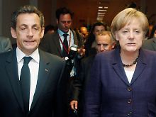 So hat man sich das alles in Paris und Berlin nicht vorgestellt: Unter dem Druck der Ereignisse bleibt wohl kaum ein anderer Ausweg, als die nationale Budgethoheit zu beschneiden. Im Bild: Präsident Sarkozy mit Bundeskanzlerin Merkel beim Krisentreffen vom vergangenen Wochenende.
