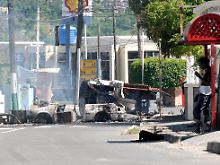 Belagerte errichteten Barrikaden auf den Straßen.