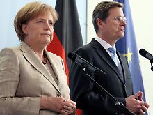 "Jetzt wird die Handschrift der Koalition sichtbar", sagt Merkel mehr als acht Monate nach der Bundestagswahl.