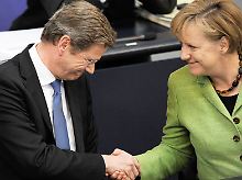 Westerwelle und Merkel hatten schon andere Anlässe zum Jubeln.
