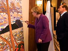 Gebremste Kreativität: Merkel legt Hand an eine Kopie eines Bildes eines zeitgenössischen kanadischen Künstlers.