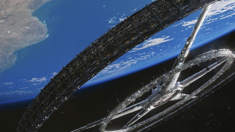 Nicht ganz losgelöst von der Erde: Elysium schwebt über dem blauen Planeten.
