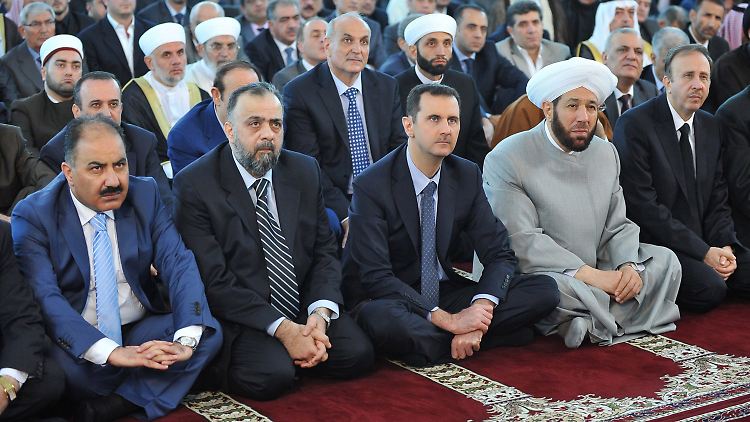 Ist Barri oder dessen Bruder neben Assad zu sehen?