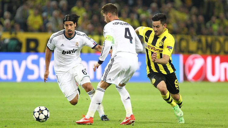 Ein weiterer Konkurrent für den verletzten Sami Khedira (links) im Real-Mittelfeld? Ilkay Gündogan ist angeblich heiß begehrt in Madrid.
