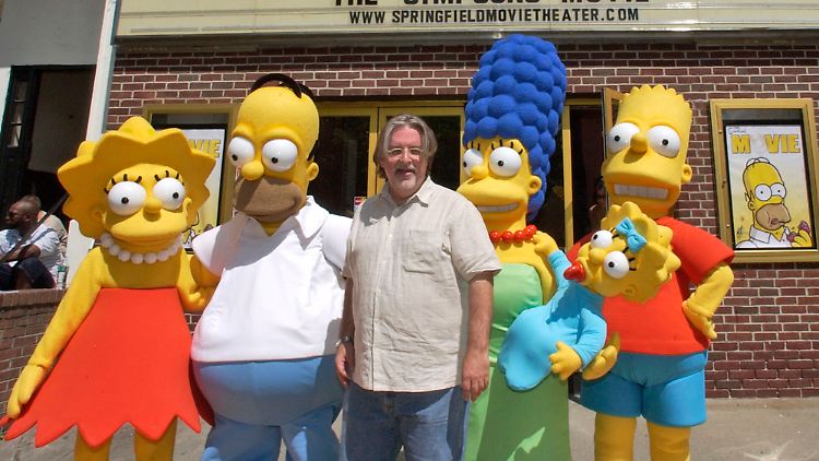 Matt Groening mit seinen berühmtesten Figuren: den Simpsons.