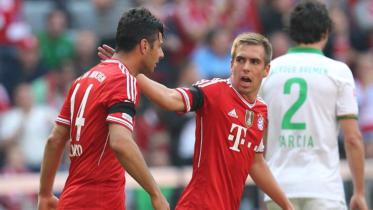 Obacht vor Real: Bayerns Kapitän Philipp Lahm und der Kollege Claudio Pizarro.