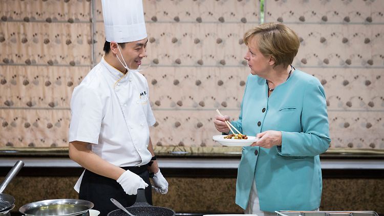 Essen ja, Kochen nein: Kanzlerin Angela Merkel will ihren Chinabesuch nicht zur Show werden lassen.