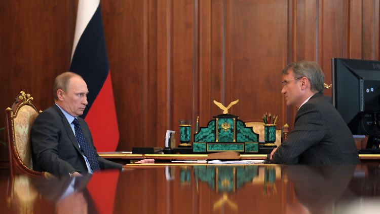 Russland Präsident Wladimir Putin und Sberbank-Chef German Gref.