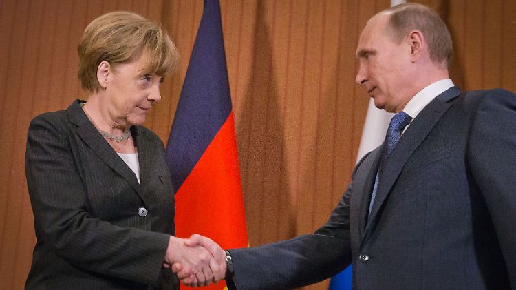 Merkel und Putin bei einem Treffen in der Normandie im Juni diesen Jahres zur Feier des D-Days.