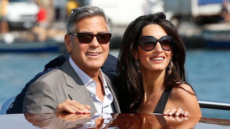 Sie genießen die Sonne Italiens: Alamuddin und ihr Verlobter Clooney bei ihrer Ankunft in Venedig.