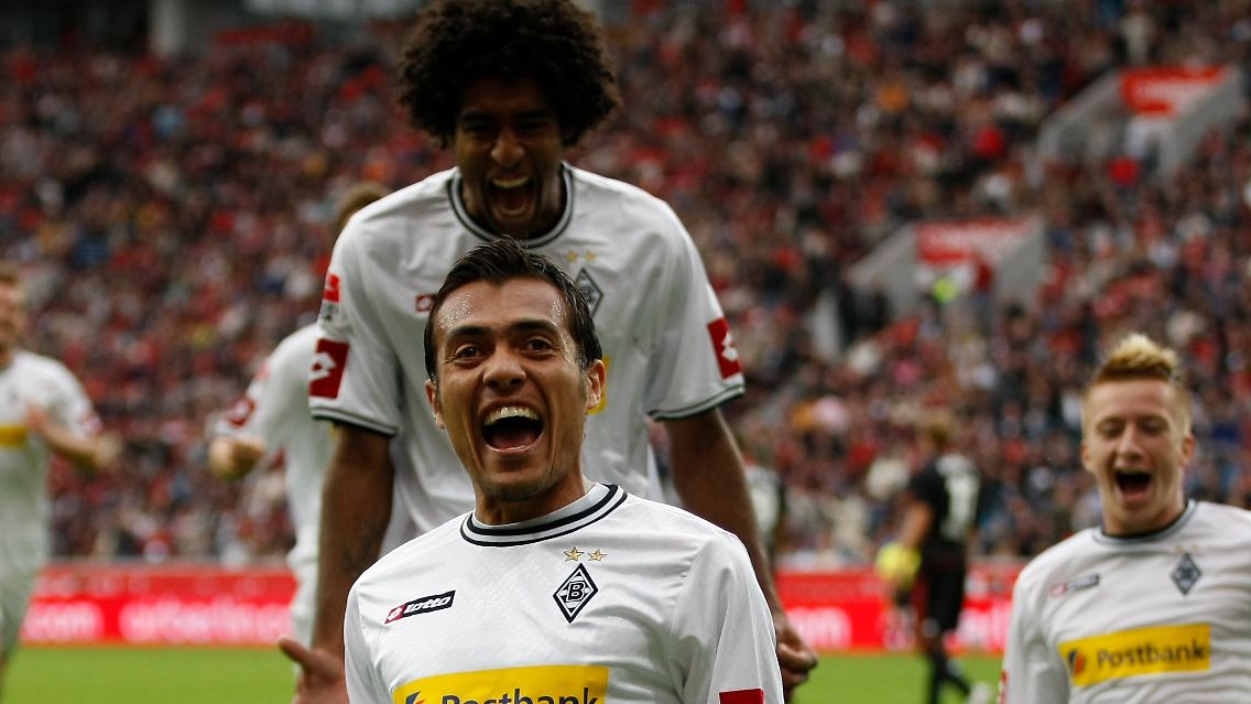Völlig entfesselt: Die Gladbacher Dante Bonfim, links, Juan Arango und Marco Reus feiern.