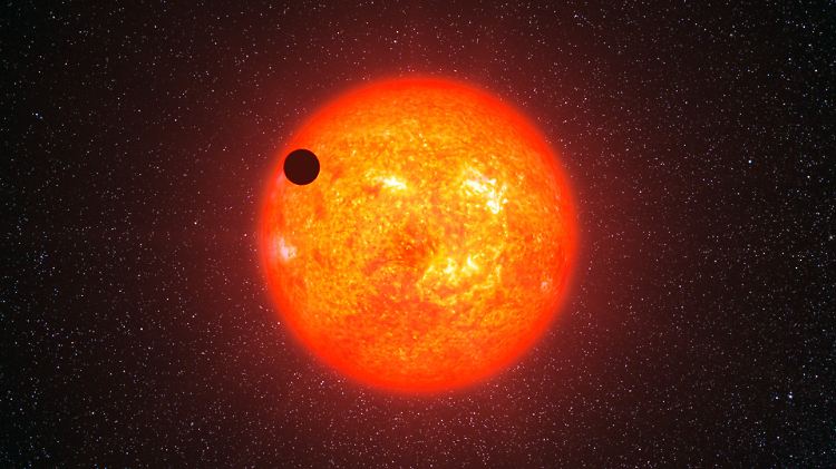 Eine Illustration von Gliese 1214b, der um seinen Heimatstern kreist. Gliese 1214b ist eine Supererde, rund 42 Millionen Lichtjahre von uns entfernt.