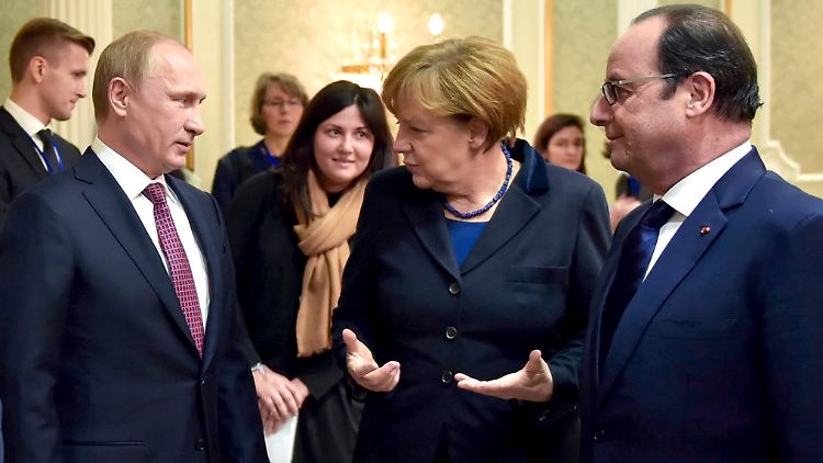 Alle einverstanden? Putin, Merkel und Hollande konnten sich mit dem ukrainischen Präsident Poroschenko immerhin auf eine gemeinsame Erklärung einigen.