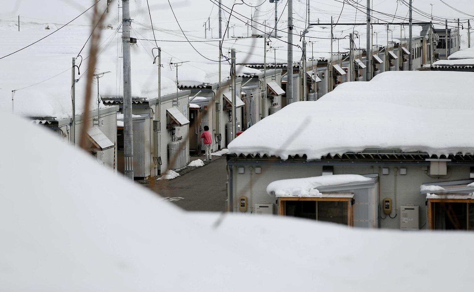 Vier Jahre nach der Dreifach-Katastrophe von Fukushima leben noch immer rund 93.000 Menschen in containerähnlichen Behelfsunterkünften. 