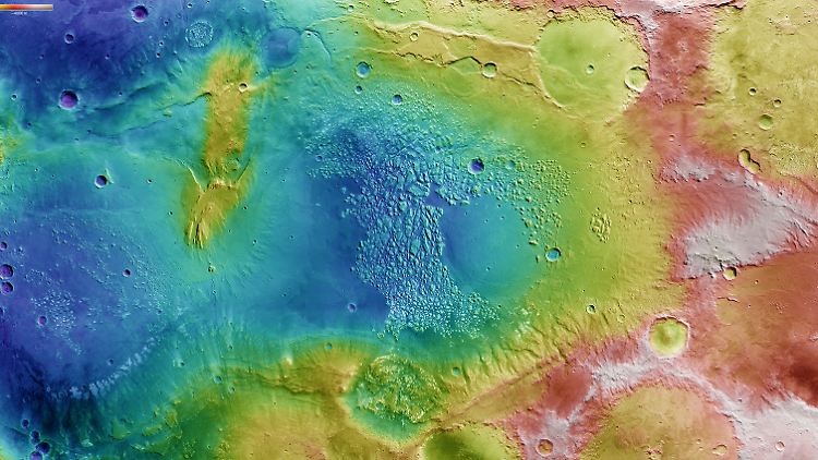 Das bunte Bild von Terra Sirenum zeigt die südliche Hemisphäre des Mars. Die blau eingefärbten Gebiet sind tiefliegend, die roten und weißen sind die höchsten.