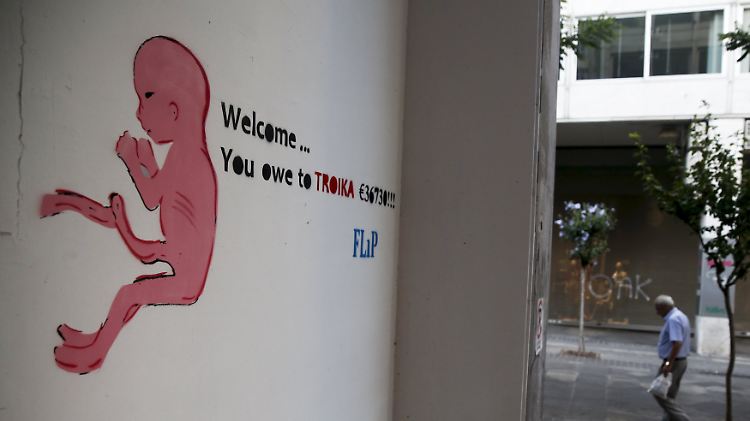 "Willkommen... du schuldest der Toika 36.730 Euro", heißt es auf diesem Graffito in Athen.