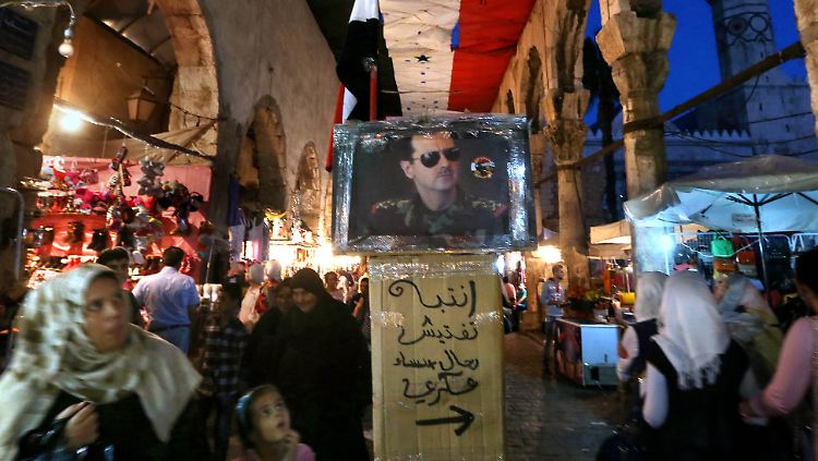 Der syrische Präsident Baschar al-Assad hier auf einem Porträt in der Altstadt von Damaskus.