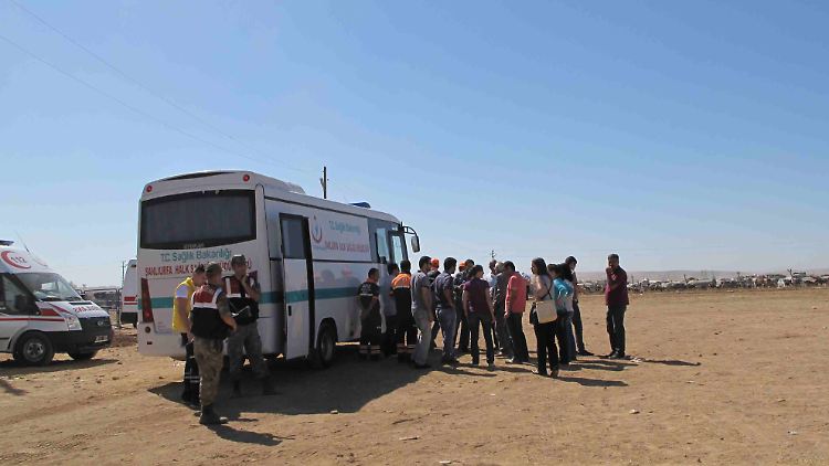 Flüchtlinge an der türkisch-syrischen Grenze.