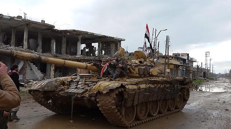 Kurz vor Beginn der Verhandlungen toben die Kämpfe unvermindert weiter: Hier rücken syrische Regierungstruppen in das von Rebellen eroberte Scheich Mischkeen ein.