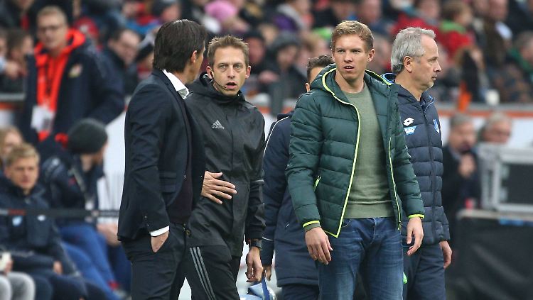 Roger Schmidt (l.) attackiert seinen Hoffenheimer Kollegen.