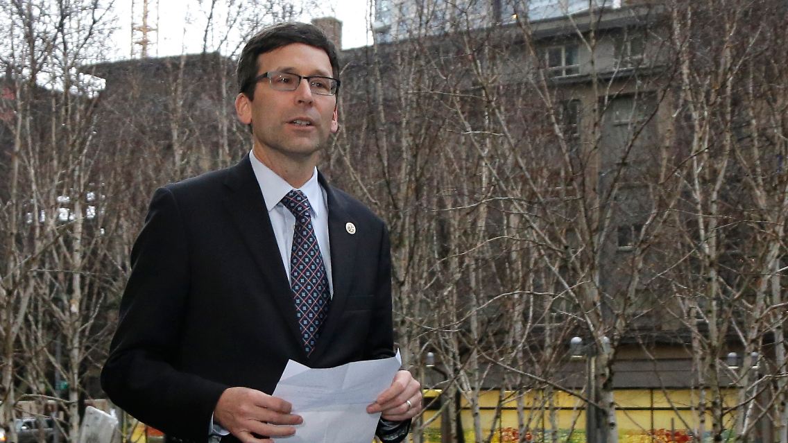 Washington Attorney General Bob Ferguson arrives to talk to reporters, following a hearing in federal court Friday, Feb. 3, 2017, in Seattle. A U.S. judge on Friday temporarily blocked President Donald Trump's ban on people from seven predominantly Muslim countries from entering the United States after Washington state and Minnesota urged a nationwide hold on the executive order that has launched legal battles across the country. (AP Photo/Ted S. Warren)