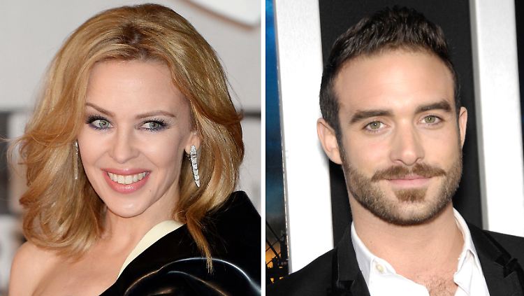 Der britische Schauspieler Joshua Sasse (r.) soll Kylie Minogue betrogen haben.