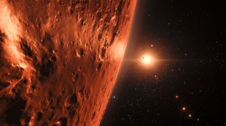 Der Stern Trappist-1 wird von sieben Planeten umkreist - die sich hier ein Künstler vorgestellt hat.