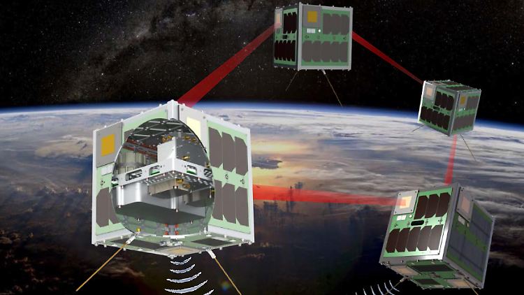 Die künstlerische Darstellung zeigt, wie die vier Nano-Satelliten im All miteinander kommunizieren.