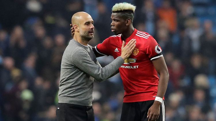 Glückwunsch: Josep Guardiola und Paul Pogba.