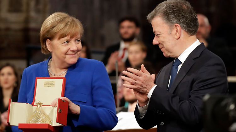 Preisträger unter sich: Merkel und ihr Vorgänger, der Friedensnobelpreisträger Juan Manuel Santos.