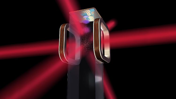 Eine grafische Darstellung des Nasa-Experiments: Ein Chip und eine elektromagnetische Kammer helfen, Atome auf ein milliardstel Grad über dem absoluten Nullpunkt von rund minus 273 Grad Celsius herunterzufrieren.